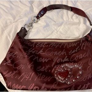 Excellent shape Coach bag. Burgundy with logo.